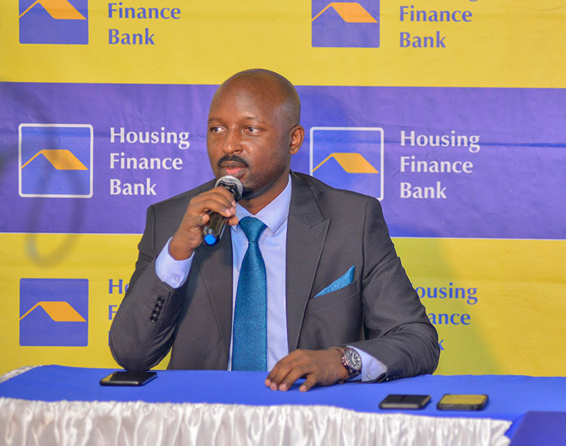 John Baptist Kaweesi, the Head of Mortgage and Consumer Banking addresses guests during the launch of the Double-Double Unsecured Salary Loan Campaign