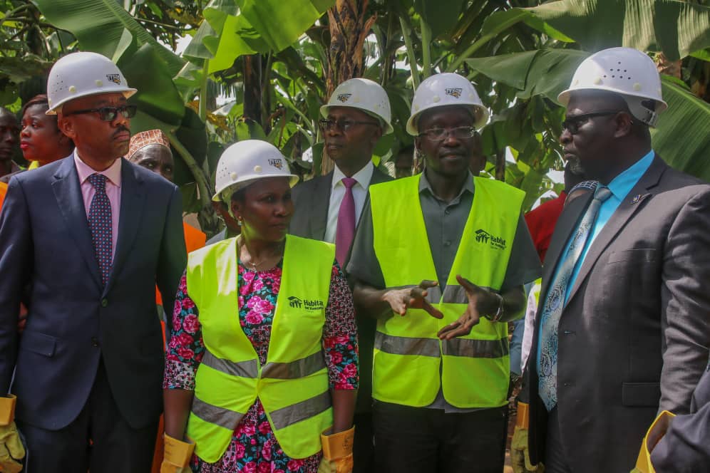 Housing Finance Bank's Managing Director- Mr. Michael.K.Mugabi, Habitat For Humanity's National Director, Mrs. Leticia Kiyingi, 2nd Deputy Prime Minister Buganda Kingdom, Owekitiibwa Robert Waggwa Nsibirwa ahead of the ground breaking activity to launch the "Decent Living Campaign".