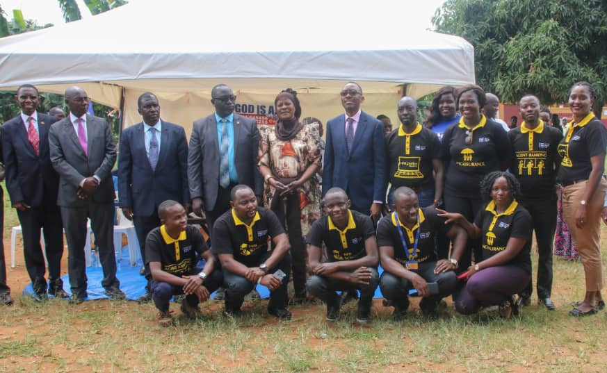Delegates from the Buganda Kingdom led by Owek. Robert Waggwa Nsibirwa together with a team from Housing Finance Bank led by the Managing Director- Mr. Michael.K.Mugabi share in a picture moment during the "Decent Living Campaign" ground breaking ceremony.