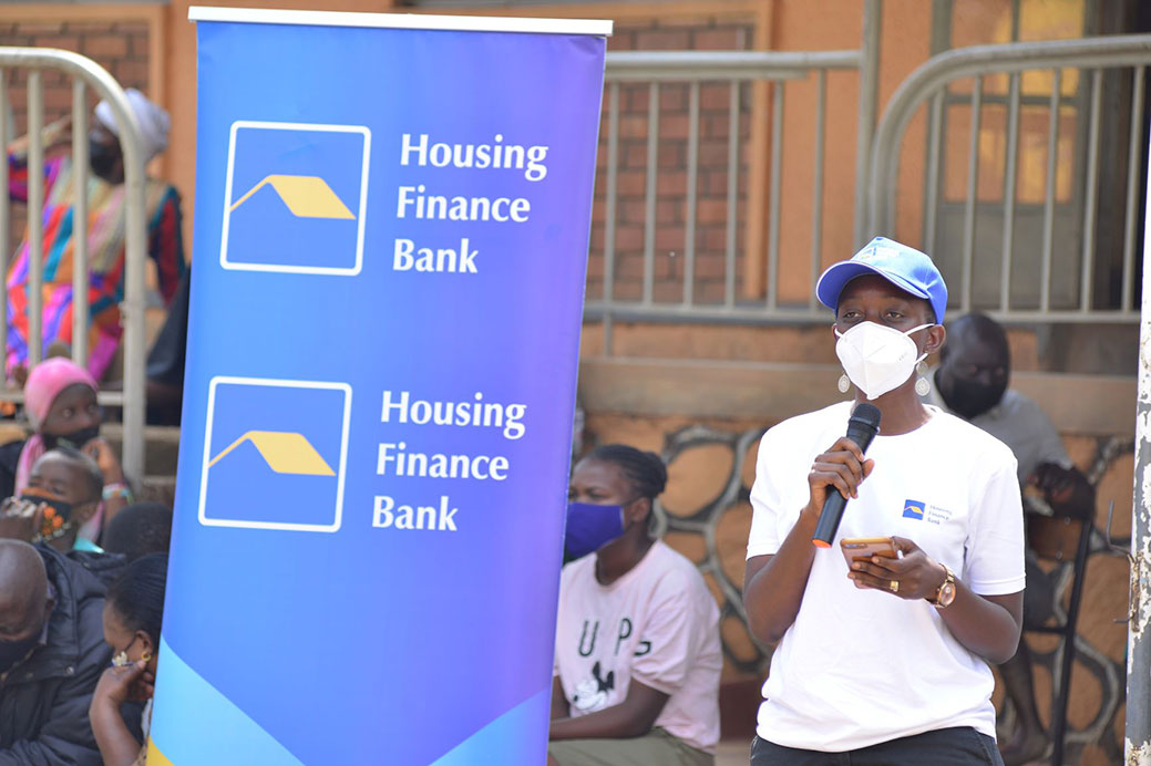 Housing Finance Bank Chief Risk Officer Marietta N Mwesigwa speaks during the handover ceremony