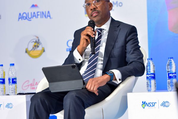 Mr Michael Mugabi, the Managing Director of HFB addressing media, stalkerholdrs and partners after committing UGX 100M