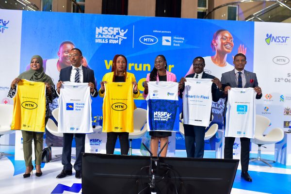 Mr Michael Mugabi,(2nd Left) the Managing Director of HFB pose for a group photo with partners from MTN, NSSF, Next Media