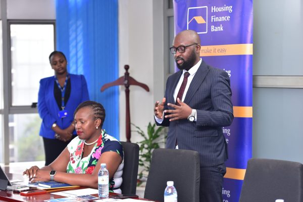 John Baptiste Kaweesi, Head of Mortages and Consumer Banking at Housing Finance Bank, addressing the media at the Head Office during the signing of the MOU with Pearl Marina Estate