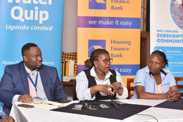 Doreen Nyiramugisha(Center),Head Marketing and Communication of Housing Finance Bank addressing media, partners, parents and teachers at the commissioning of a water purification system at St. Joseph N