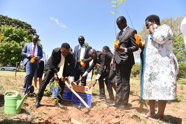 Housing-Finance-Bank-Managing-Director-Michael-Mugabi-(center)-joined-other-HFB-staff-officials-and-planted-1500-trees--in-Teso-sub-region