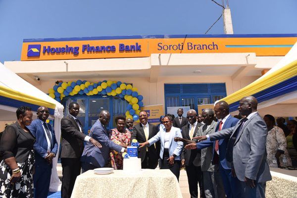 Vice-President-Jessica-Alupo,-and-Michael-Mugabi-MD-Housing-Finance-Bank(Center)-joins-other-HFB-officials-to-cut-the-cake-during-the-opening-of-Soroti-Branch