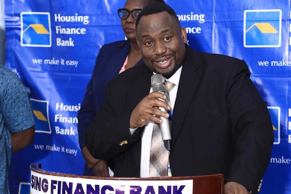 Ivan-Kituka,-HFB’s-Head-of-Distribution-and-Alternative-Channels-addresses-customers-and-media-at-the-recent-HFB-Hoima-Customer-Forum